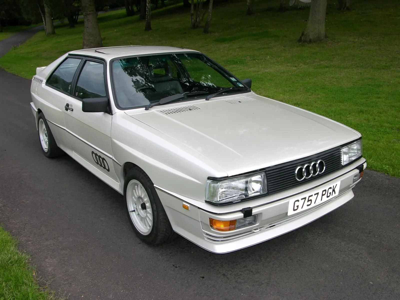 White Audi Quattro 20V parked on a lawn